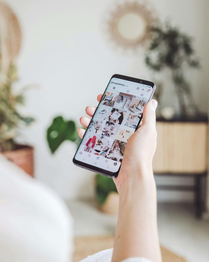 woman looking at instagram on her phone